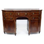 AN ANTIQUE MAHOGANY BOW FRONTED SIDE BOARD with rosewood stringing to the top, arching drawers and