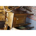 AN EDWARDIAN MAHOGANY POT CUPBOARD together with a nest of three occasional tables; an oval tray