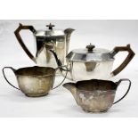 A SHEFFIELD SILVER FOUR PIECE TEA SET consisting of a tea pot, water jug, a cream jug and sugar bowl