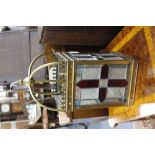 A VICTORIAN STYLE BRASS HANGING LANTERN with coloured glass panels, 47cm high