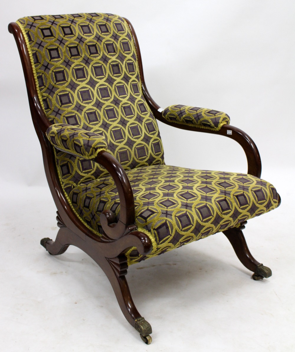 A VICTORIAN MAHOGANY FRAMED OPEN ARMCHAIR with overstuffed upholstered back, arms and seat, the
