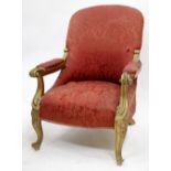 AN ANTIQUE CARVED GILT OPEN ARMCHAIR with scrolling arm supports and legs, 68cm wide