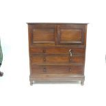 A VICTORIAN MAHOGANY MUSIC CABINET fitted with two fielded panel doors enclosing a cupboard, above