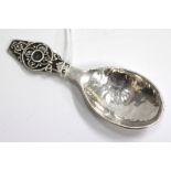 A LONDON SILVER SPOON by Amy Sandheim with beaten effect bowl, dated 1939