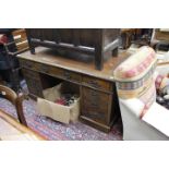 A VICTORIAN STAINED PINE PEDESTAL DESK with a leatherette inset top 137cm wide x 70cm deep