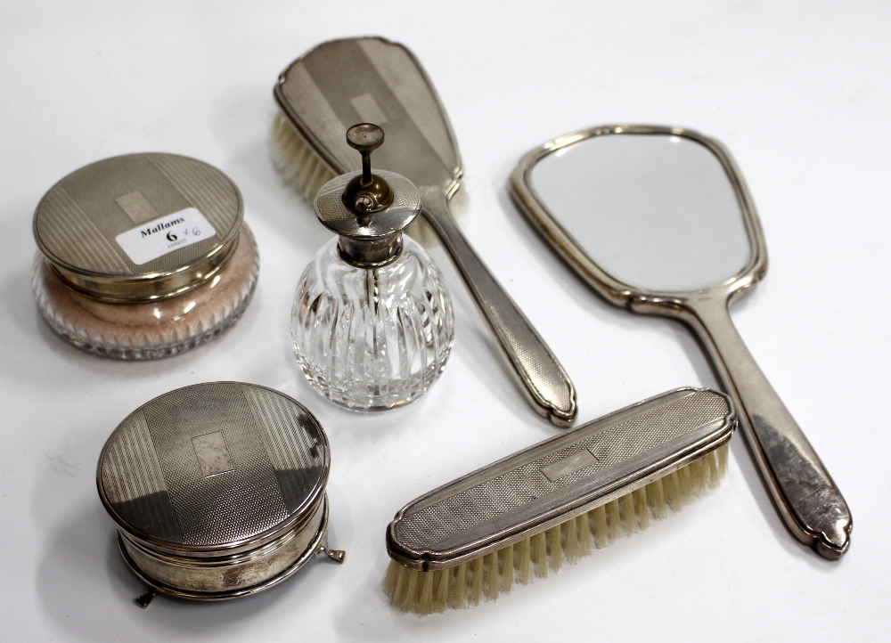 A SELECTION OF SILVER BACKED DRESSING TABLE REQUISITES including hand held mirrors, brushes, rouge