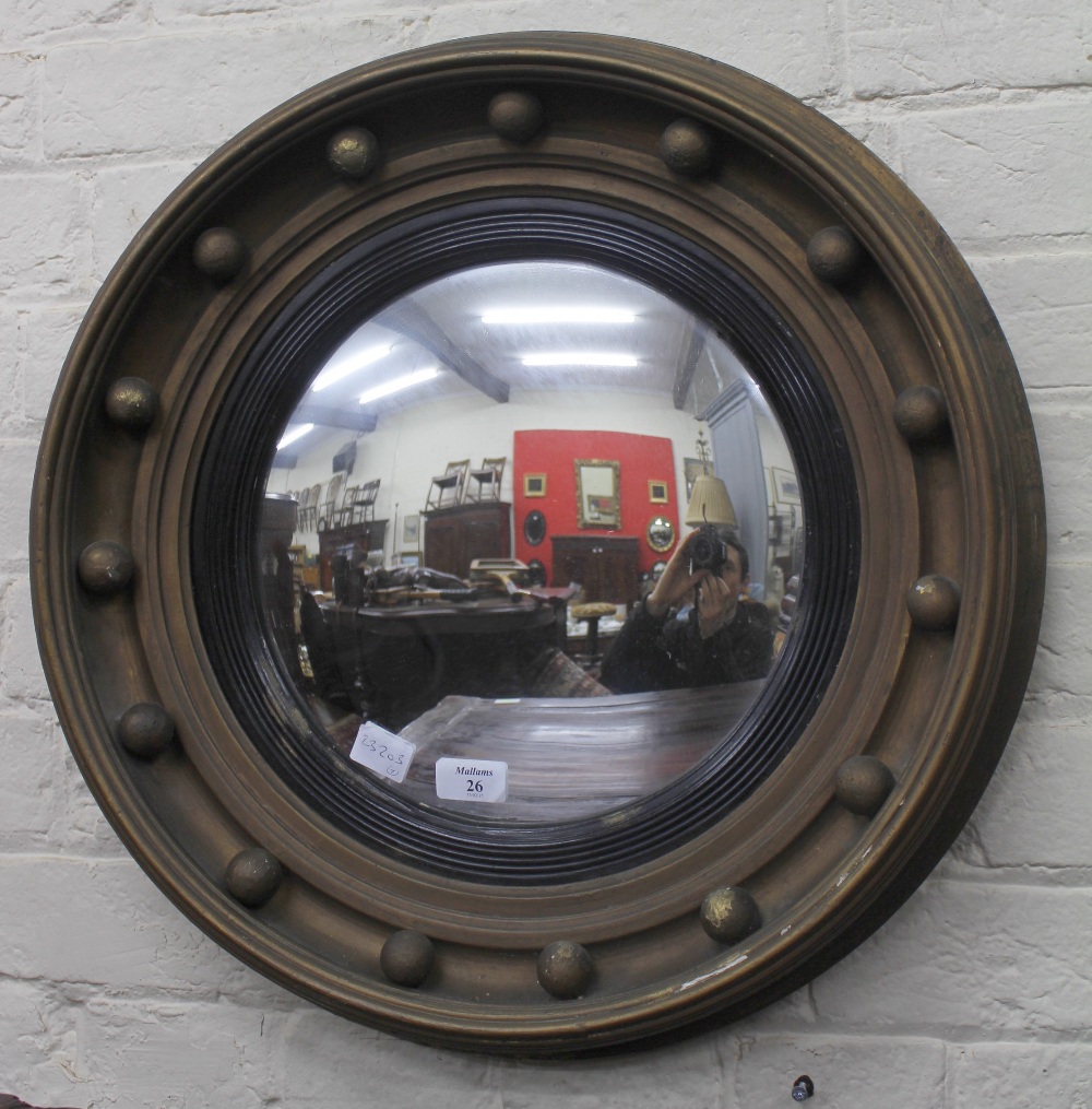 AN ANTIQUE CONVEX CIRCULAR WALL MIRROR 52cm diameter