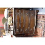 A REPRODUCTION BOW FRONTED CHEST of four drawers raised on bracket feet 71cm wide together with a