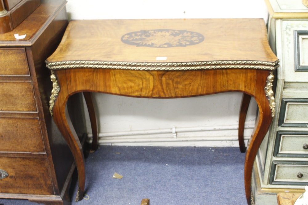 AN EARLY VICTORIAN WALNUT MARQUETRY INLAID CARD TABLE with gadrooned metal mounts 92cm x 78cm