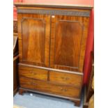 A LATE GEORGIAN MAHOGANY CUPBOARD fitted with two fielded panel doors above two short and one long