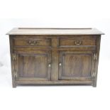 AN 18TH CENTURY OAK THREE PLANKED TOP SIDEBOARD with replaced hinges and replaced handles, fitted