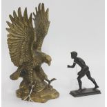 A GRAND TOUR TYPE BRONZE FIGURE of an athlete 13cm in height and a brass statue of an eagle 26cm
