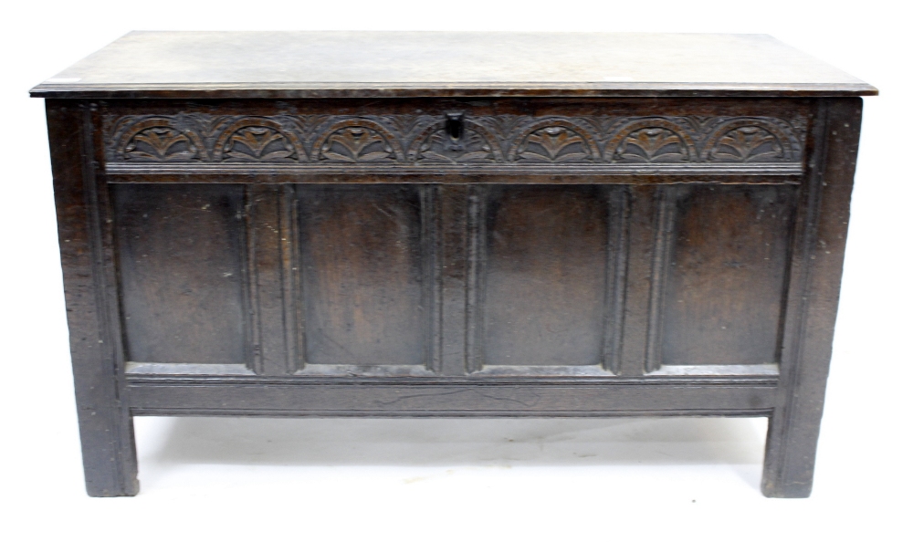 AN ANTIQUE OAK COFFER with quadruple panelled front 106cm wide x 59cm high