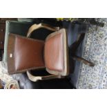 A 1930'S SWIVEL OFFICE CHAIR with a leatherette panel