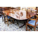 A GEORGE III STYLE TRIPLE PEDESTAL MAHOGANY DINING TABLE each pedestal with reeded sabre legs