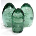 A GROUP OF THREE GREEN GLASS DUMP PAPERWEIGHTS, cone shaped with internal three tier fountain