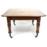 A VICTORIAN MAHOGANY DRAWER LEAF DINING TABLE, including three leaves, with turned legs and brass