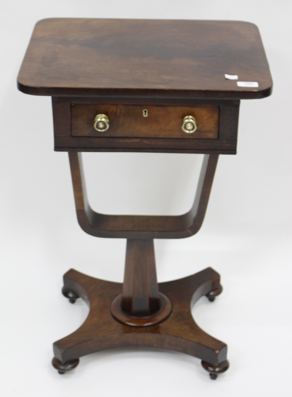 A 19TH CENTURY MAHOGANY WORK TABLE standing on tapering bun feet, fitted with frieze drawer 73cm