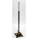 A REGENCY STYLE METAL LAMP STANDARD on square spreading base 147cm high