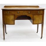 A SMALL EARLY 20TH CENTURY WALNUT KNEEHOLE DRESSING TABLE and an enclosed corner wash stand (2)