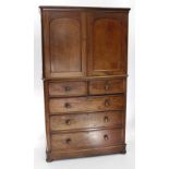 A MID 19TH CENTURY MAHOGANY LINEN PRESS or wardrobe standing on bun feet 111cm x 197cm x 53cm