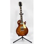 A GIBSON EPIPHONE LES PAUL MODEL GUITAR 100cm in length together with a guitar stand (2)