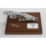 A CHROME PLATED JAGUAR LEAPING CAT CAR MASCOT mounted on oak plinth