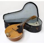 AN OLD MANDOLIN in a fitted case, 62cm in length