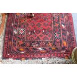 A MIDDLE EASTERN RED GROUND RUNNER 83cm x 300cm