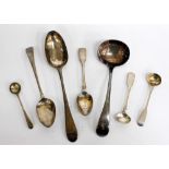 A QUANTITY OF GEORGIAN SILVER SPOONS serving ladles with crested monogram etc.,