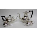 A MAPPIN & WEBB FOUR PIECE TEA AND COFFEE SET consisting of a tea pot, coffee pot, cream jug and