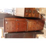 A PAIR OF MAHOGANY PEDESTALS for use as bedside cabinets, each with four drawers