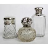 A VICTORIAN SILVER LIDDED SCENT BOTTLE and two other silver topped dressing table requisites (3)