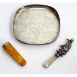 AN ANTIQUE MOTHER OF PEARL HANDLED TEETHER and a Mister Punch rattle, a silver mounted cheroot