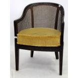 A VICTORIAN BERGERE CANED AND VINE CARVED TUB CHAIR with cushion, 82cm high