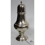 A BIRMINGHAM SILVER SUGAR SIFTER with knopped form on a stepped base 19cm high