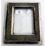 AN INDISTINCTLY MARKED WHITE METAL, POSSIBLY SILVER, AND SHAGREEN PHOTOFRAME, 24cm x 18cm (AF)
