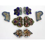 FOUR ART NOUVEAU GILT METAL AND ENAMELLED BELT BUCKLES