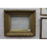 A PAIR OF GILDED RECTANGULAR PICTURE FRAMES with beaded and acanthus leaf mouldings, each aperture