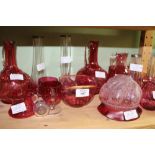 A SMALL COLLECTION OF CRANBERRY GLASS WARE to include a lampshade, jugs, bowls, vases etc.,
