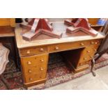 A VICTORIAN OAK PEDESTAL DESK with a leatherette inset top, 115cm wide