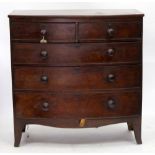 A 19TH CENTURY MAHOGANY BOW FRONTED CHEST of two short and three long drawers with turned knob