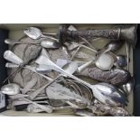 A SELECTION OF GEORGIAN AND VICTORIAN SILVER including serving spoons, teaspoons, a hand held