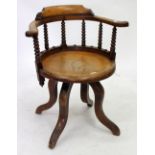 A 19TH CENTURY ASH AND ELM SWIVELLING DESK CHAIR with bobbin turned supports, 65cm wide