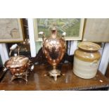 A 19TH CENTURY COPPER TEA URN or samovar with a milk glass handles and flame finial to the lid