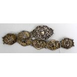 A VICTORIAN CONTINENTAL WHITE METAL CHILD'S BELT with embossed panels, marked on the clasp 800