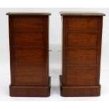 A PAIR OF VICTORIAN MAHOGANY BEDSIDE CABINETS with panelled doors standing on plinth base, 36cm wide