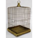 AN OLD BRASS WIRE WORK PARROT CAGE, 57cm wide x 97cm high