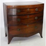 AN EARLY 19TH CENTURY MAHOGANY BOW FRONTED CHEST OF DRAWERS standing on splayed bracket feet, 93cm x