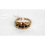 A 9CT YELLOW GOLD LATE VICTORIAN / EARLY EDWARDIAN RING inset with five stones